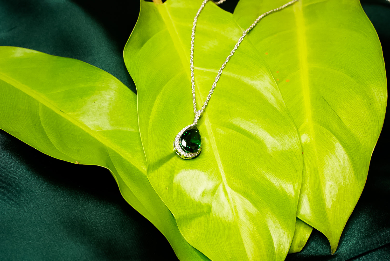 Green single stone droplet